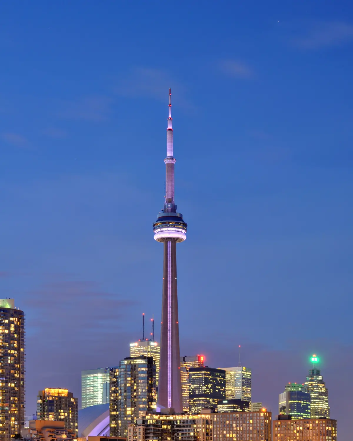 Illuminated CN Tower in Toronto at night.