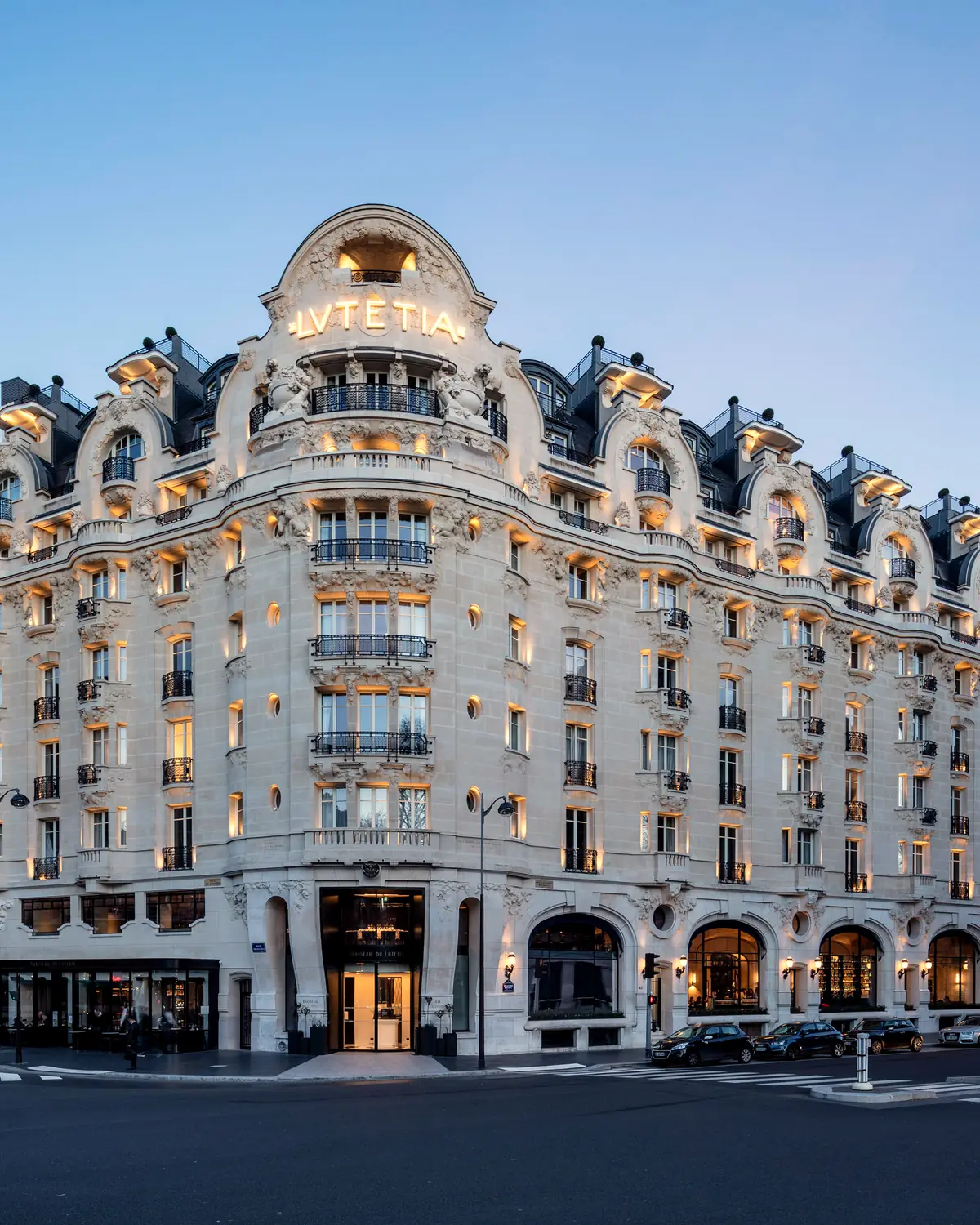 Exterior: the hotel's facade at dusk, with LVTETIA lettering on the corner dome (file 'Hotel_Lutetia_Façade_025')